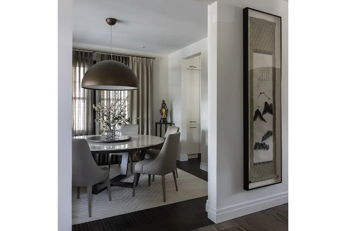 Room with antique scroll hanging on wall