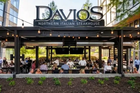 people dine at the outdoor Davio's Plaza Bar in Reston