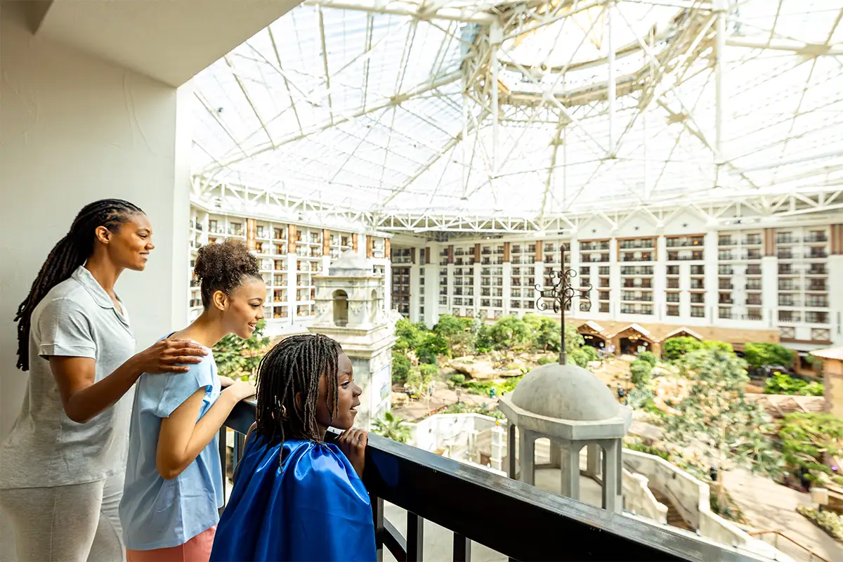 a family with a child in a cape at the Gaylord National Resort