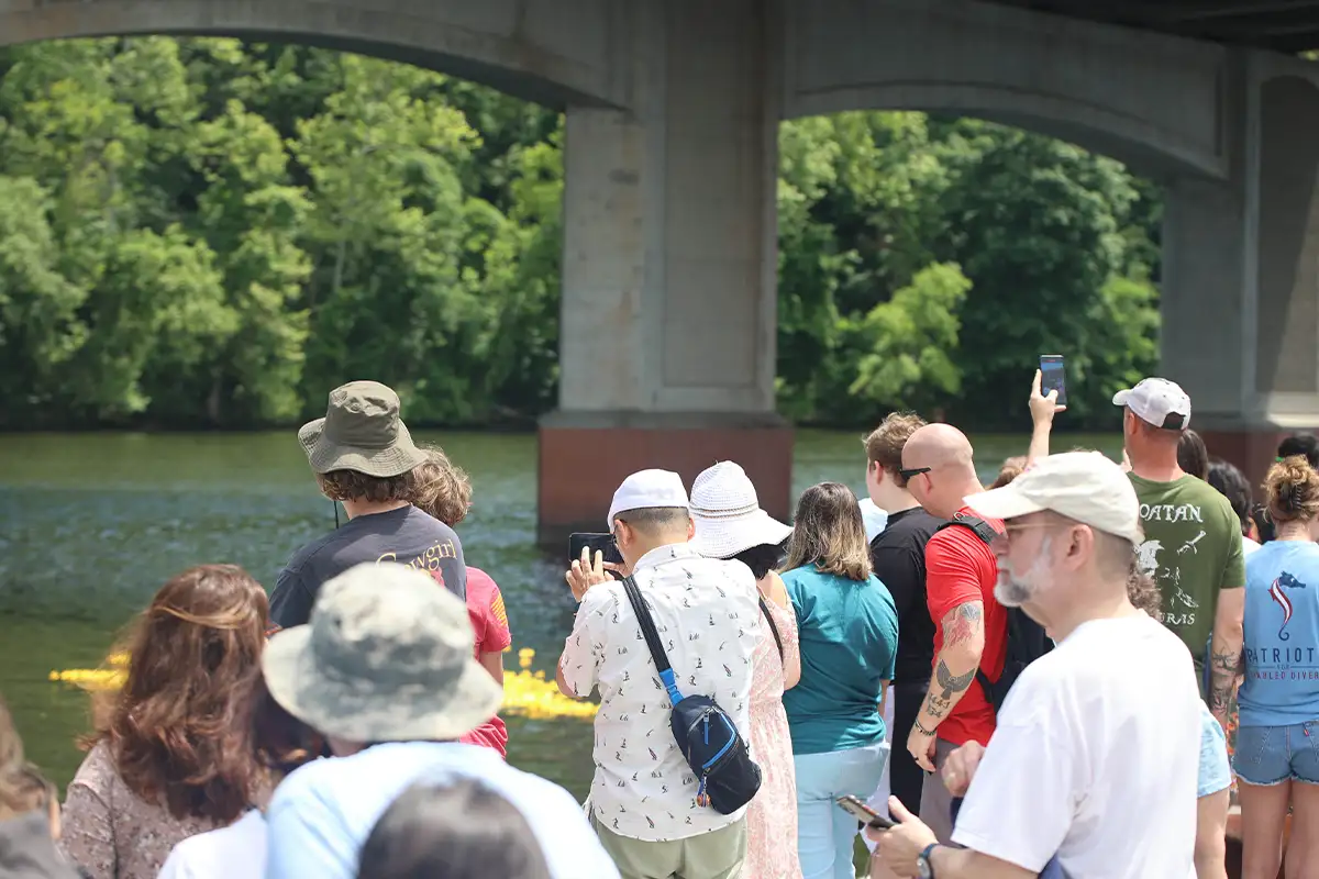 people stand on the dock watching the Occoquan Duck Splash
