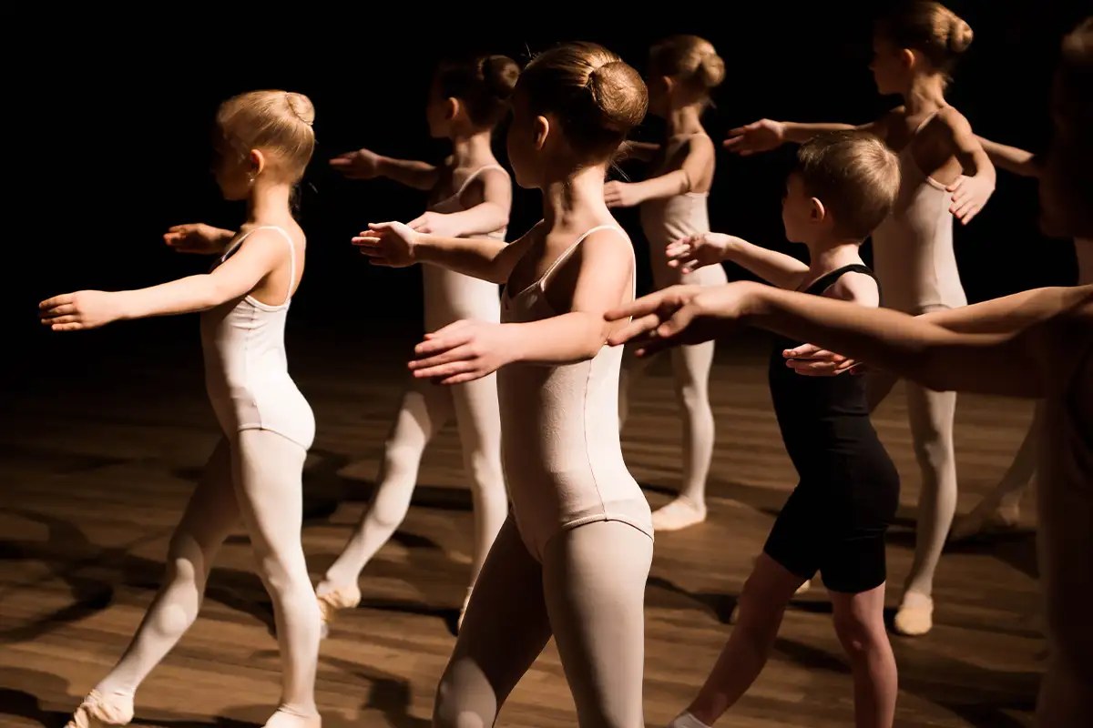 small children at a dance studio practicing ballet