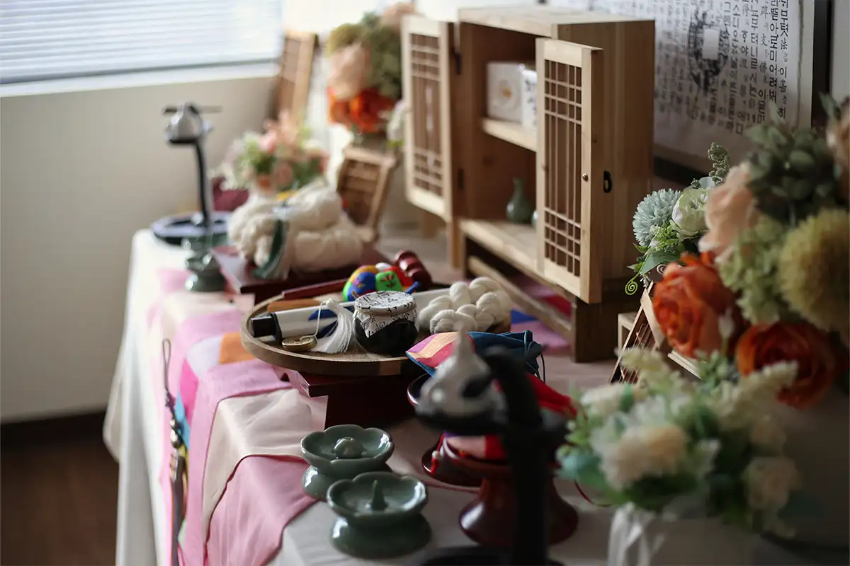 Tablescape of JS Brewery with flowers, chopsticks, etc.