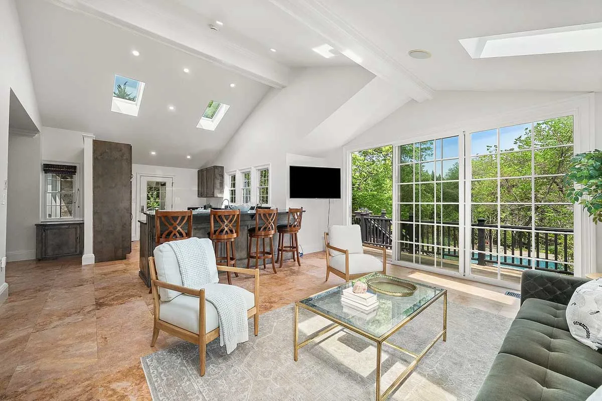 living room with sky lights and additional seating