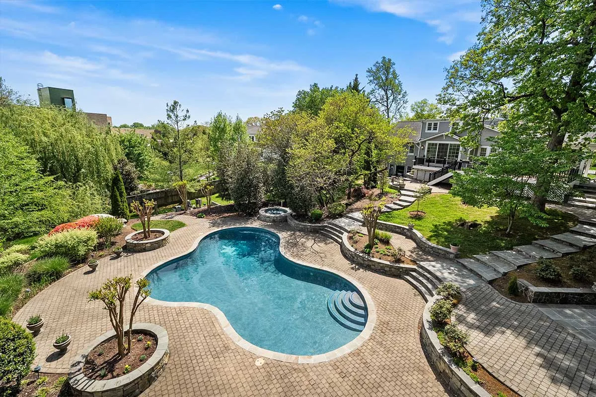 in-ground saltwater pool with hardscaping