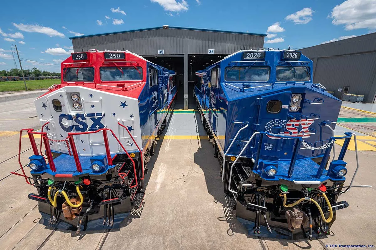 two red, white, and blue locomotives for America250