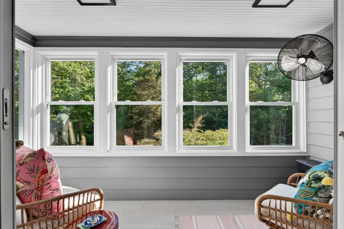Screened in porch with large windows just off primary bedroom of 3204 Mountain Rd