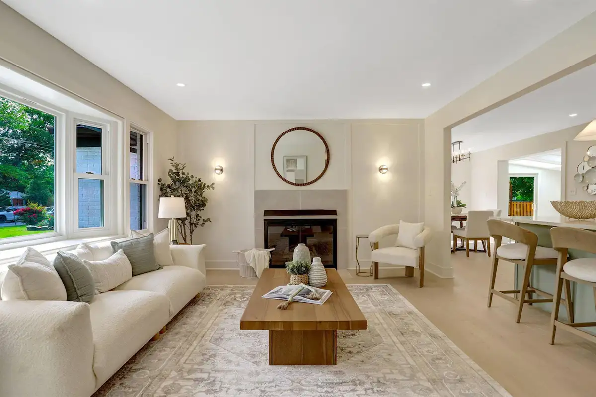 Living room with fireplace, small bay window, and white oak flooring at 3504 Gordon St