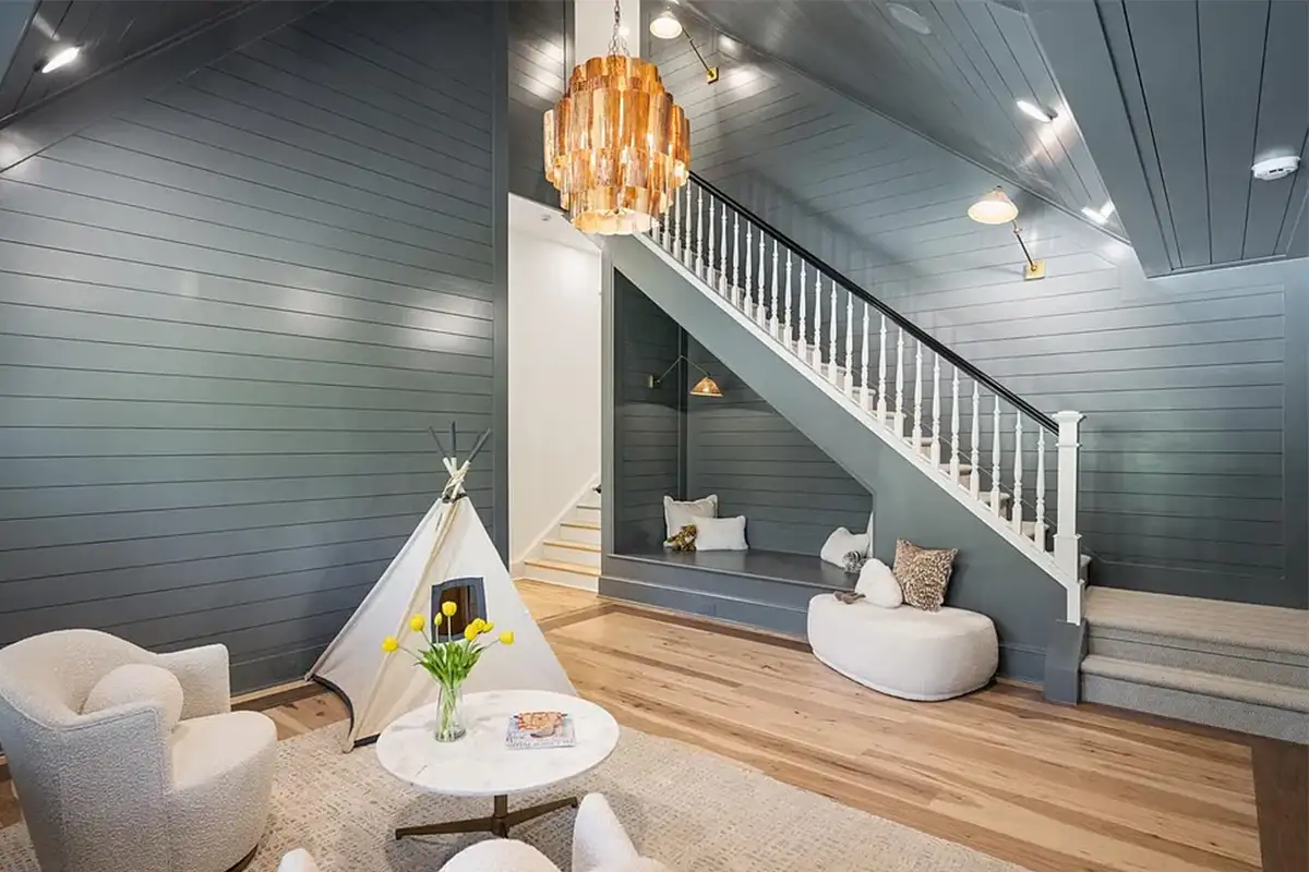 Upstairs family room with vaulted ceilings, wood paneled walls, and access to the laundry room of 4614 36th St N