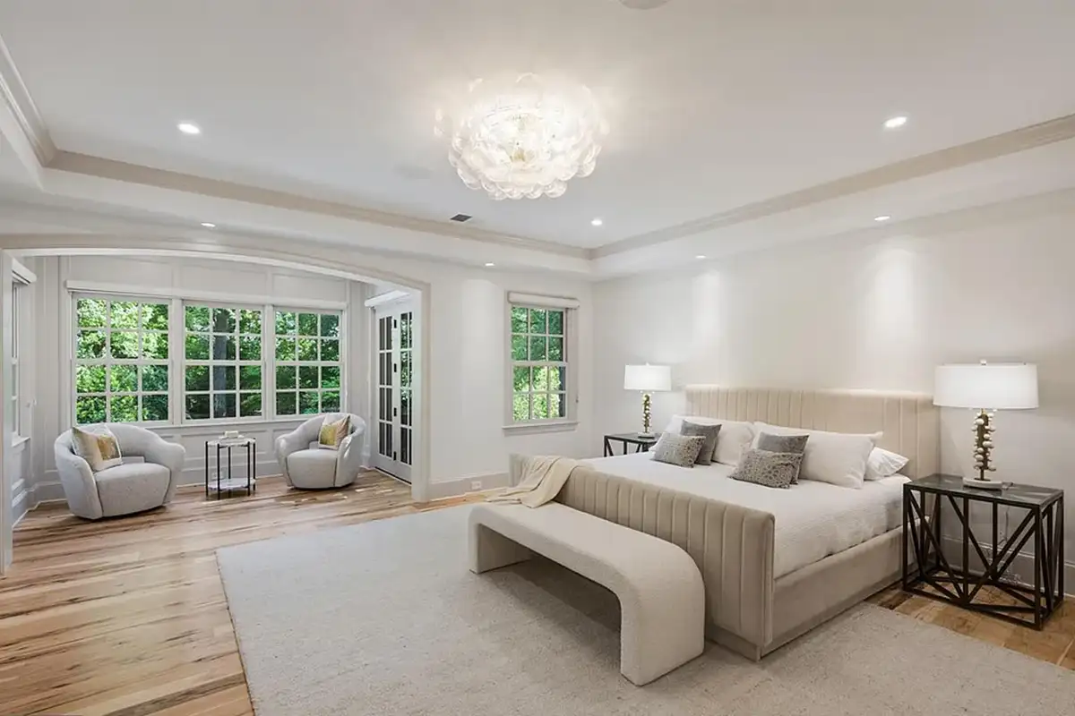 Primary bedroom with nine-foot ceilings, walk-in closet and small sitting nook of 4614 36th St N