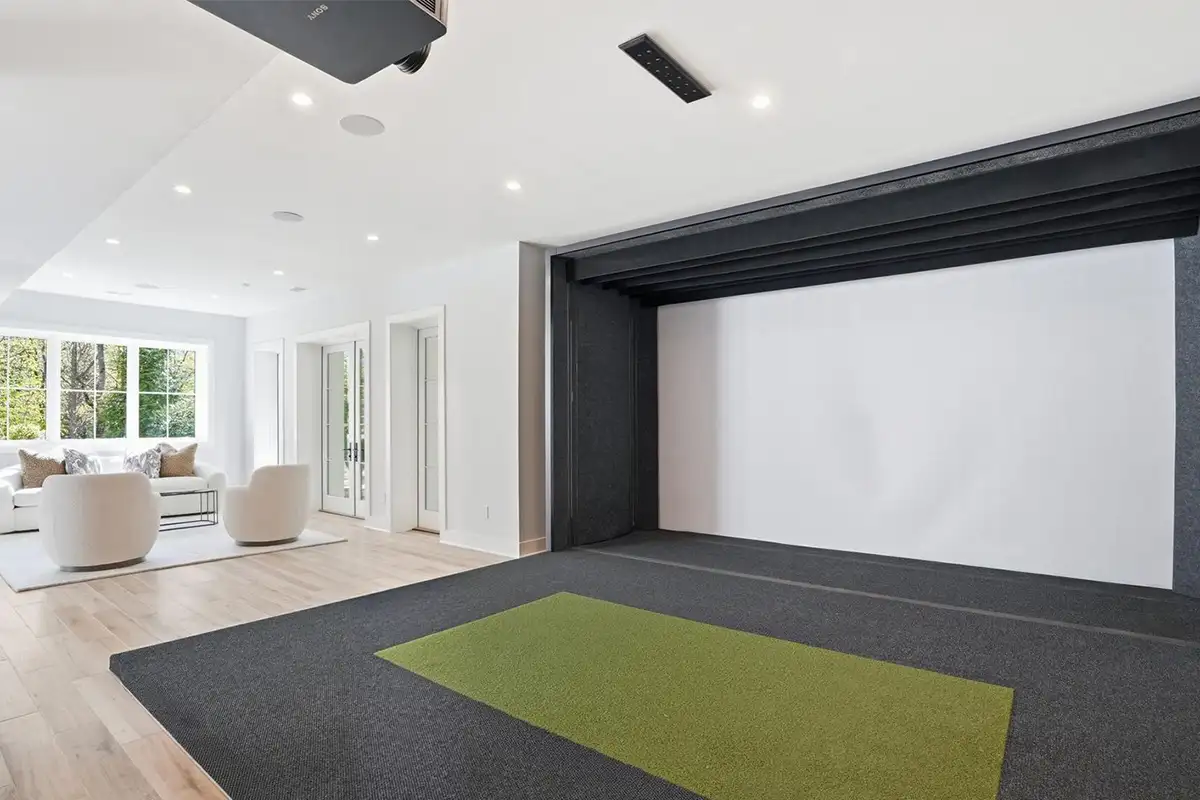 Full Swin golf simulator with integrated swing analysis and sitting area of 938 Saigon Rd
