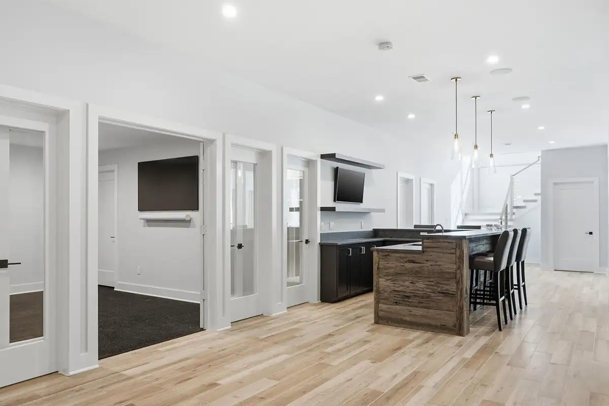 Finished basement with wine cellar, guest suite with en-suite bath, two full baths, a second laundry area, and storage of 938 Saigon Rd