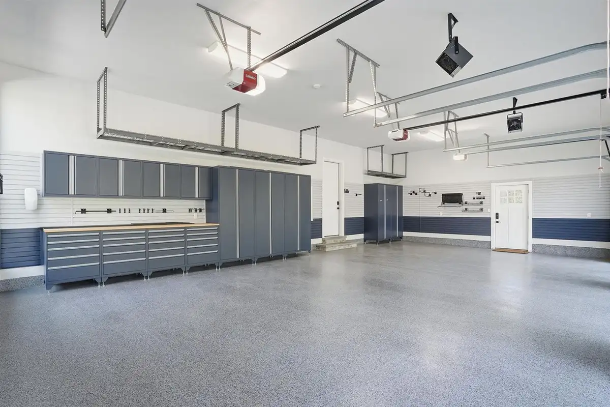 Three car garage with storage and work bench areas of 938 Saigon Rd