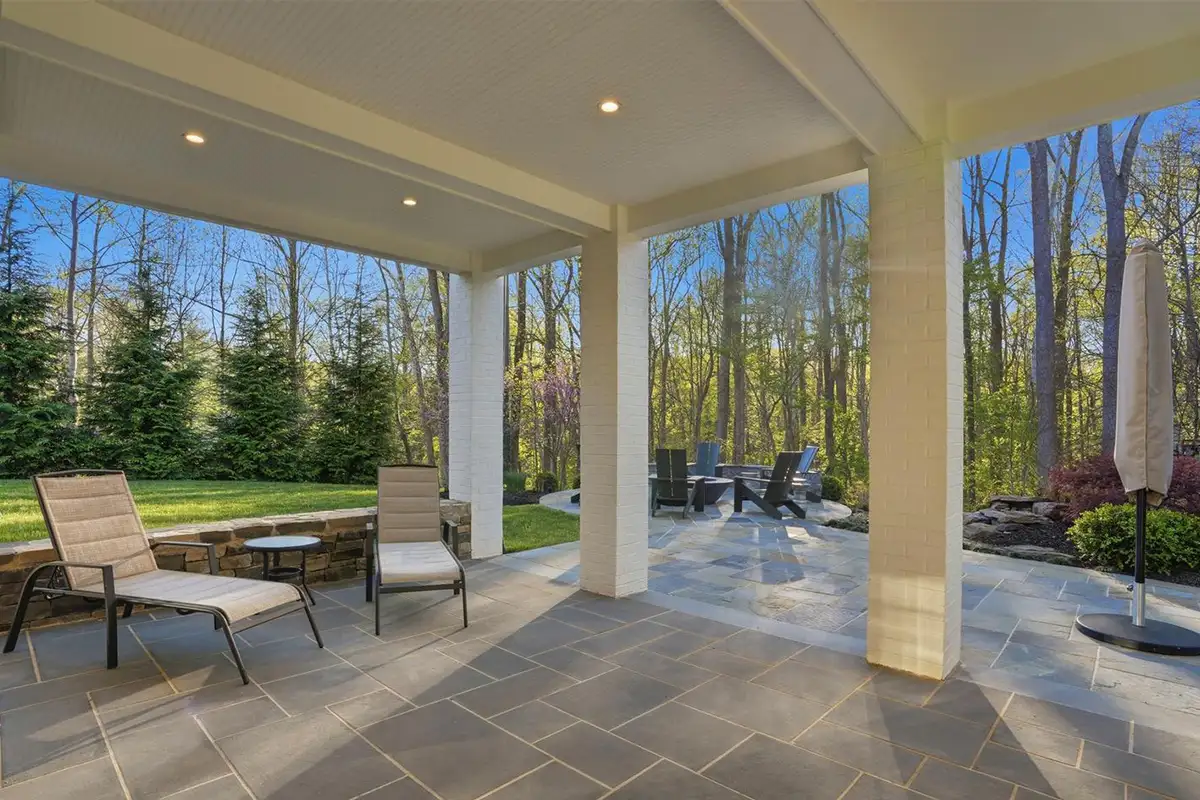 Patio area with circular fire pit, built-in audio, and various seating areas of 938 Saigon Rd