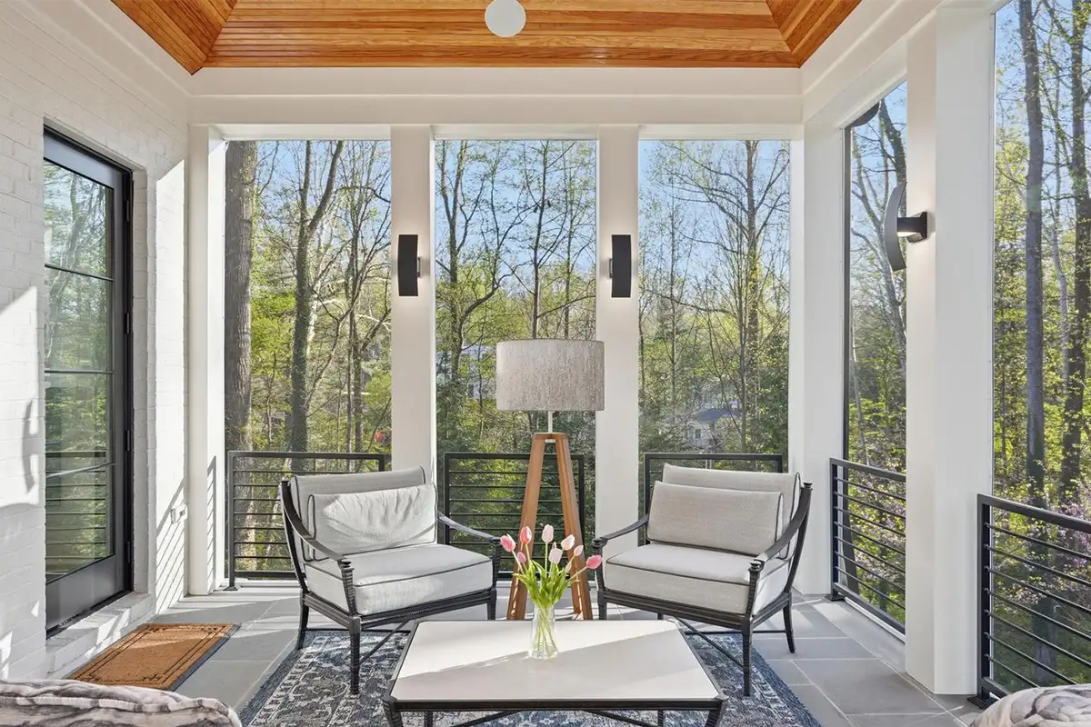 Screened in porch with heaters, ceiling fans, and outdoor media of 928 Saigon Rd