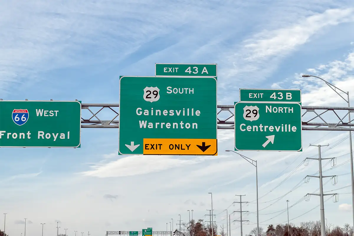 Road signs for Centreville, Gainesveile, and Front Royal on I-66 and Route 29