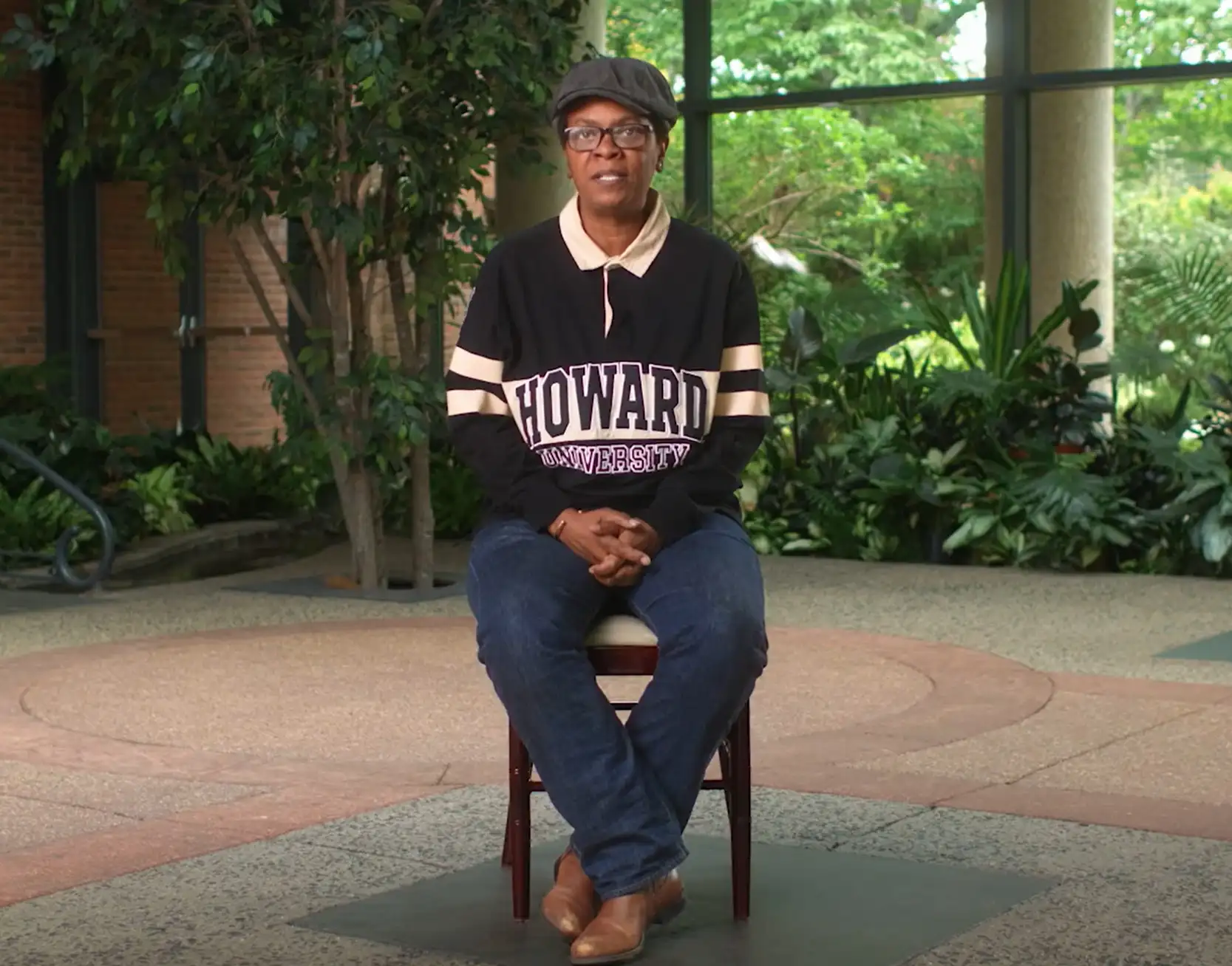 Sonja Woods sits on a chair during a documentary interview