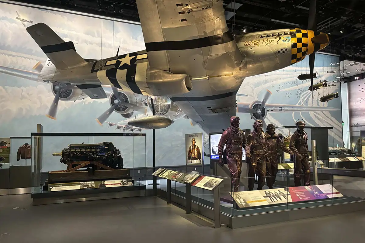 Large plane, statues of pilots, and other artifacts at new Jay I. Kislack World War II in the Air exhibit at Smithsonian Air and Space