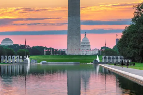 Washington Monument and US Capitol Building at sunrise in Washington, DC