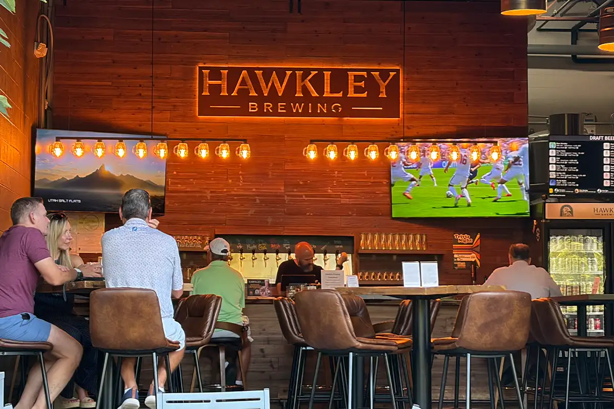 people sit at the bar at Hawkley Brewing in Herndon