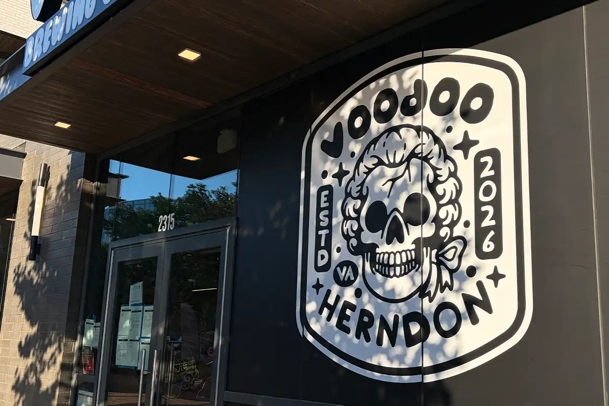 an exterior shot of the Voodoo Brewing logo on the building in Herndon