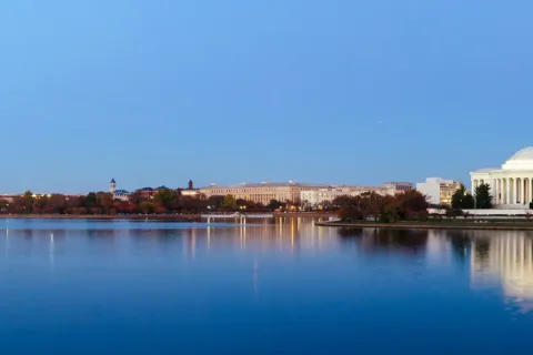 an image of Washington DC from across the Potomac River showing the Washington Monuments and Lincoln Memorial