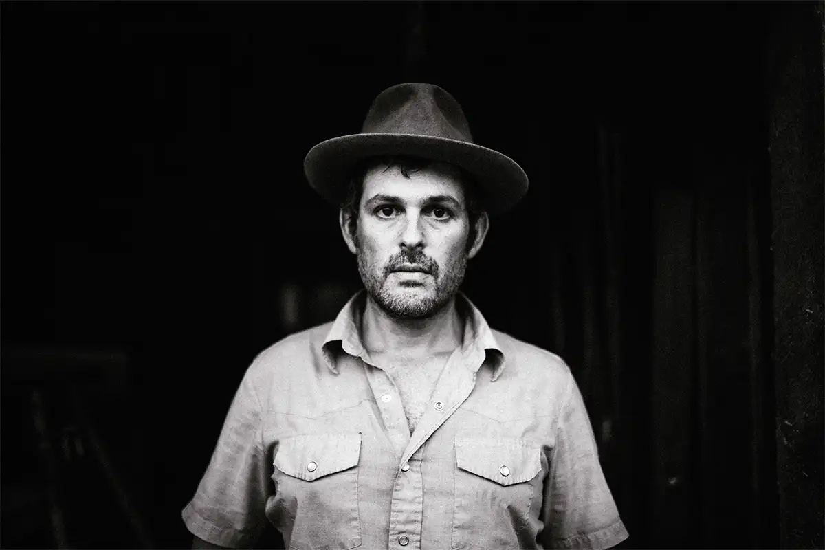Black and white headshot of Gregory Alan Isakov