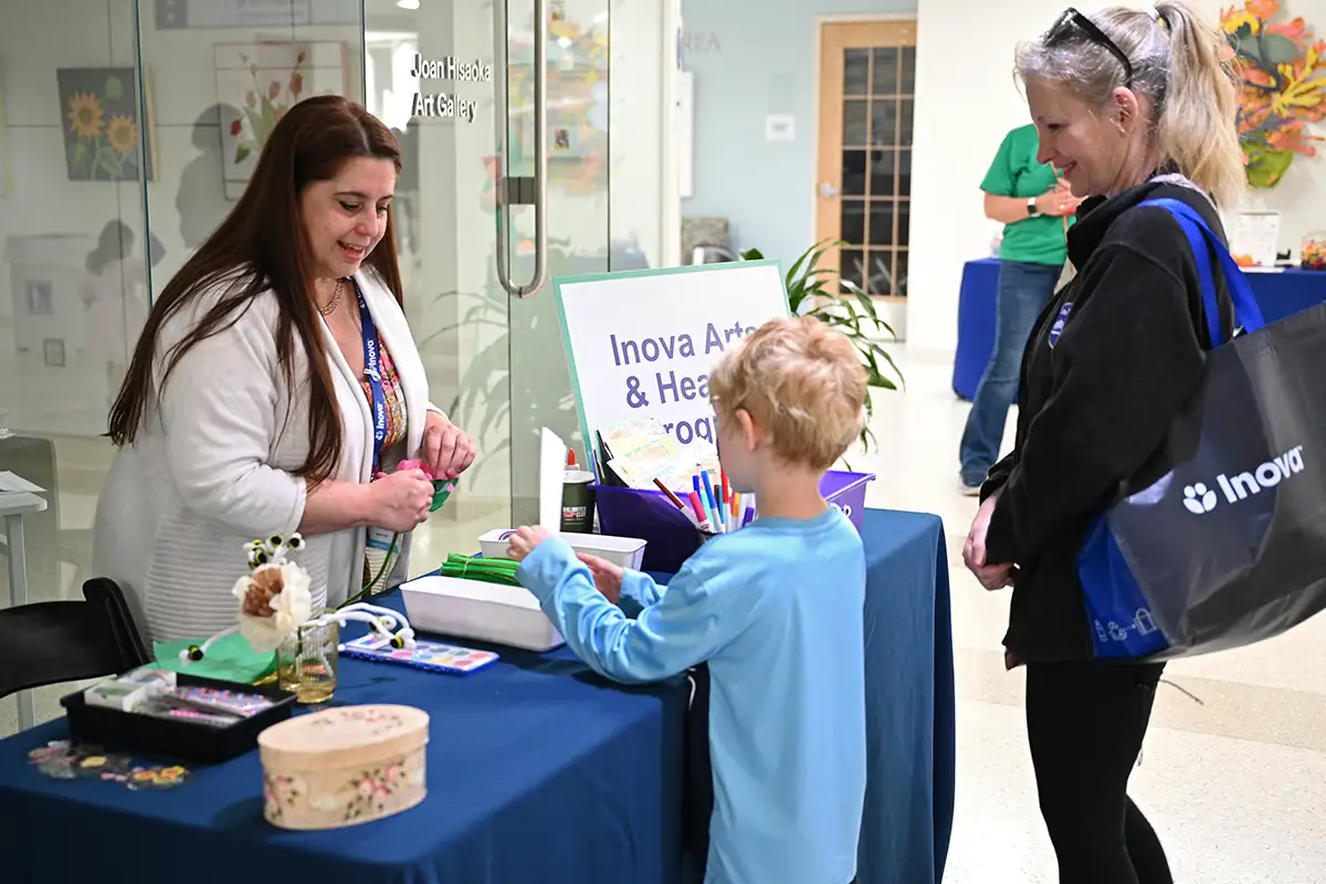 Mom and kid at arts and craft table