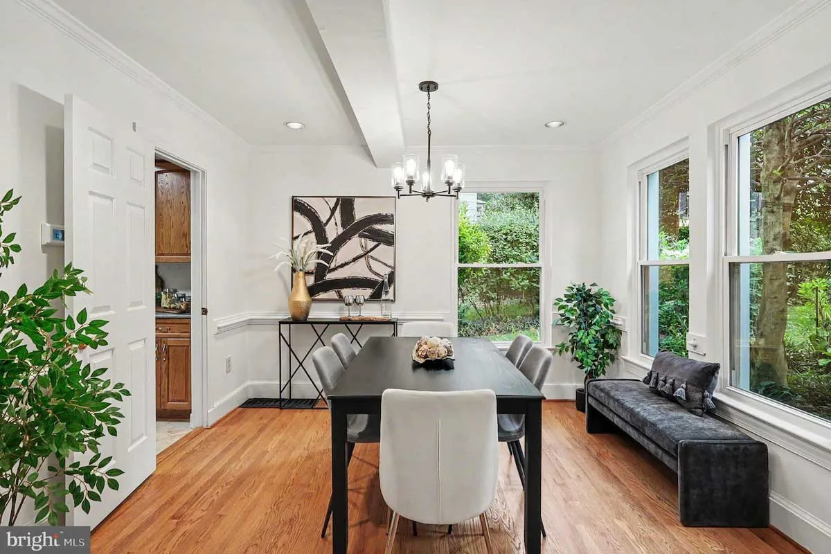 dining room with black table and sitting bench