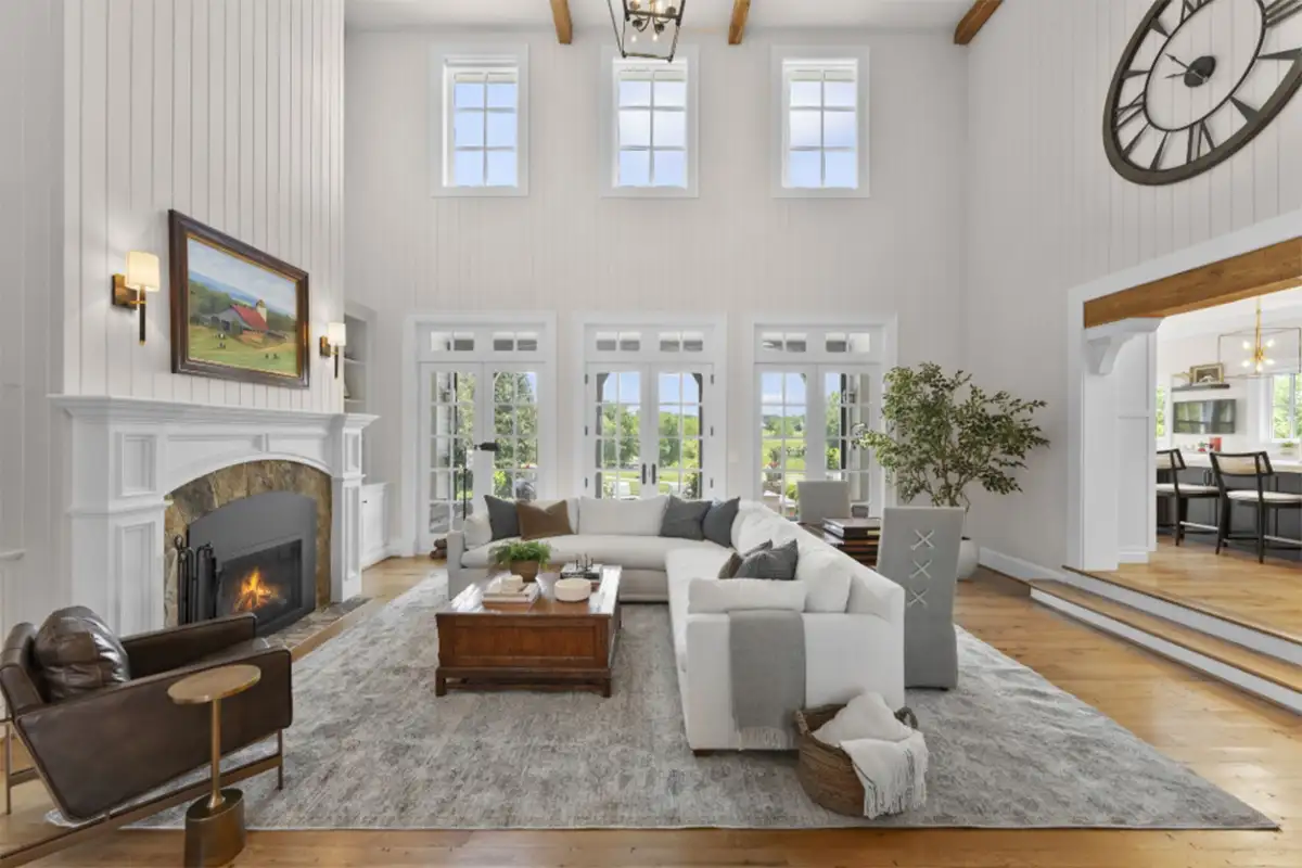 Sunken family room with exposed cathedral ceilings, various windows, and fireplace of 22364 Wilson Meadows Ln