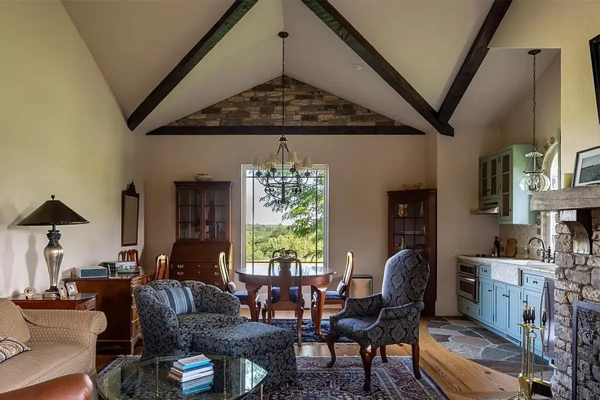 Separate guest house with stone fireplace, small kitchen, and stone accents of 2525 Gibson Ct