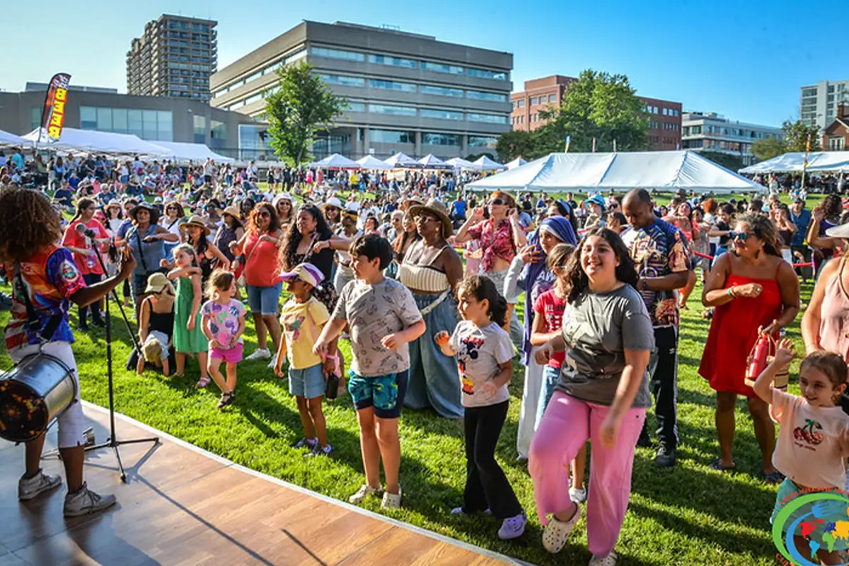 people at the stage at the Courtesy of Around the World Cultural Food Festival