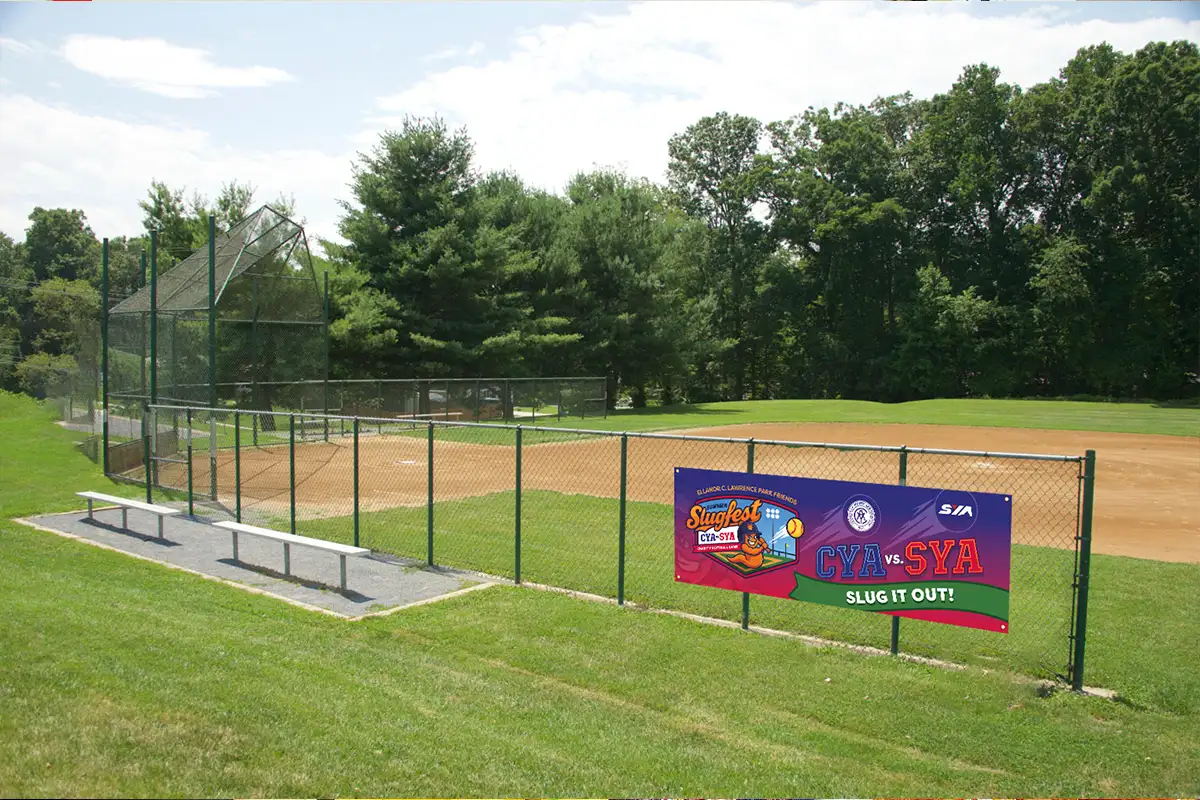 a baseball field with a Slugfest banner at Eleanor Lawrence Park
