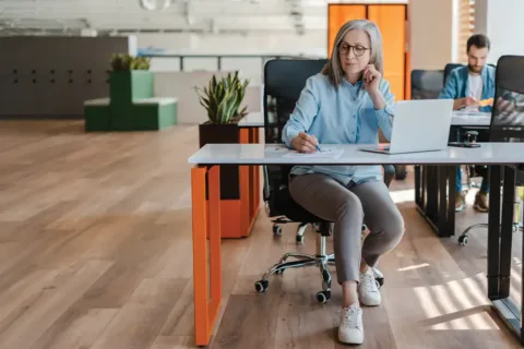 Older woman working at desk