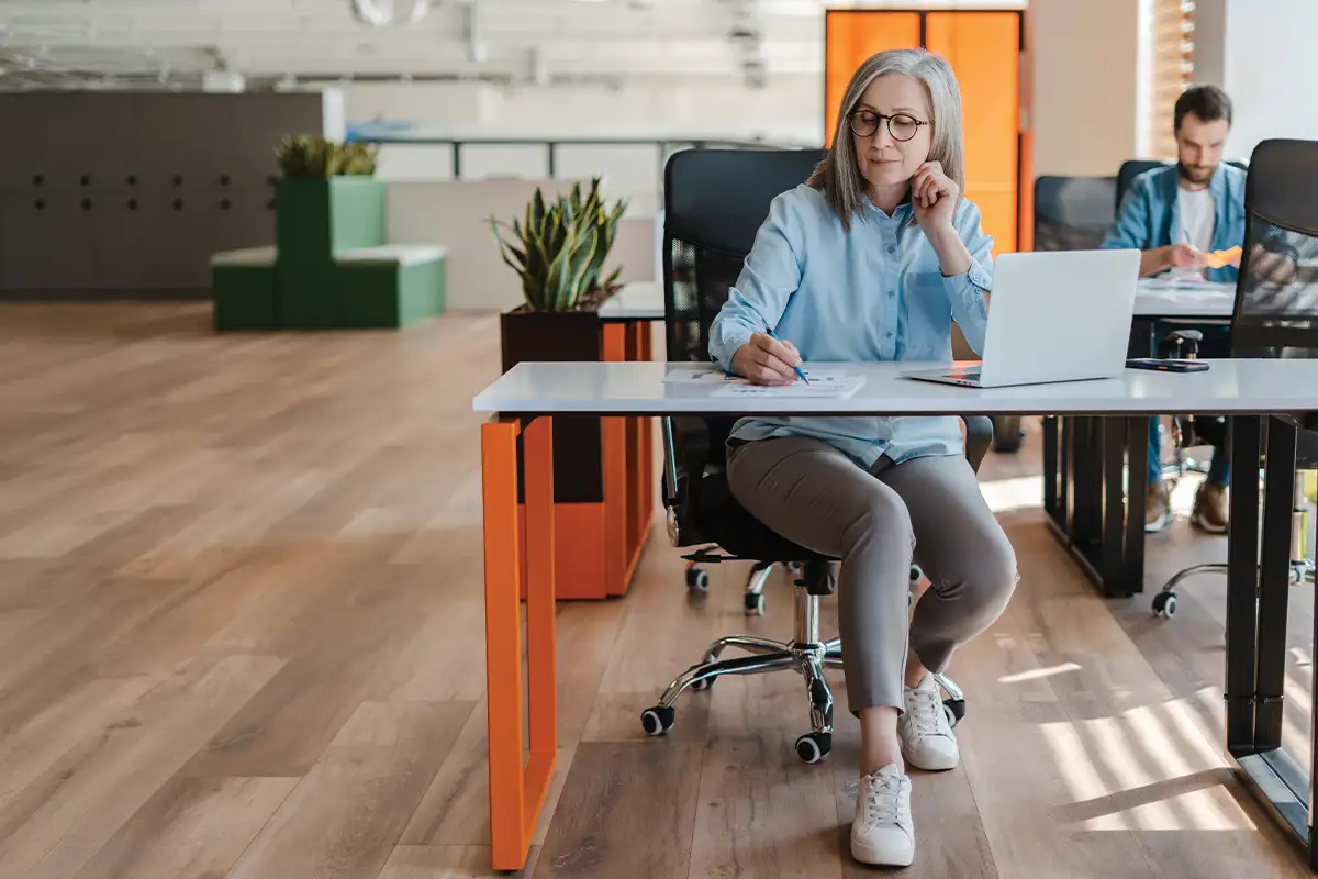 Older woman working at desk