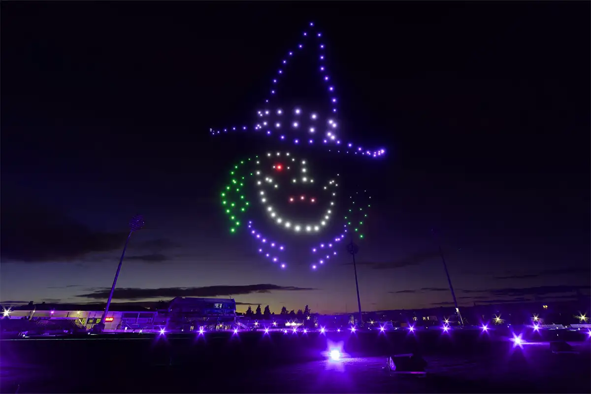 drones in the sky forming a witch