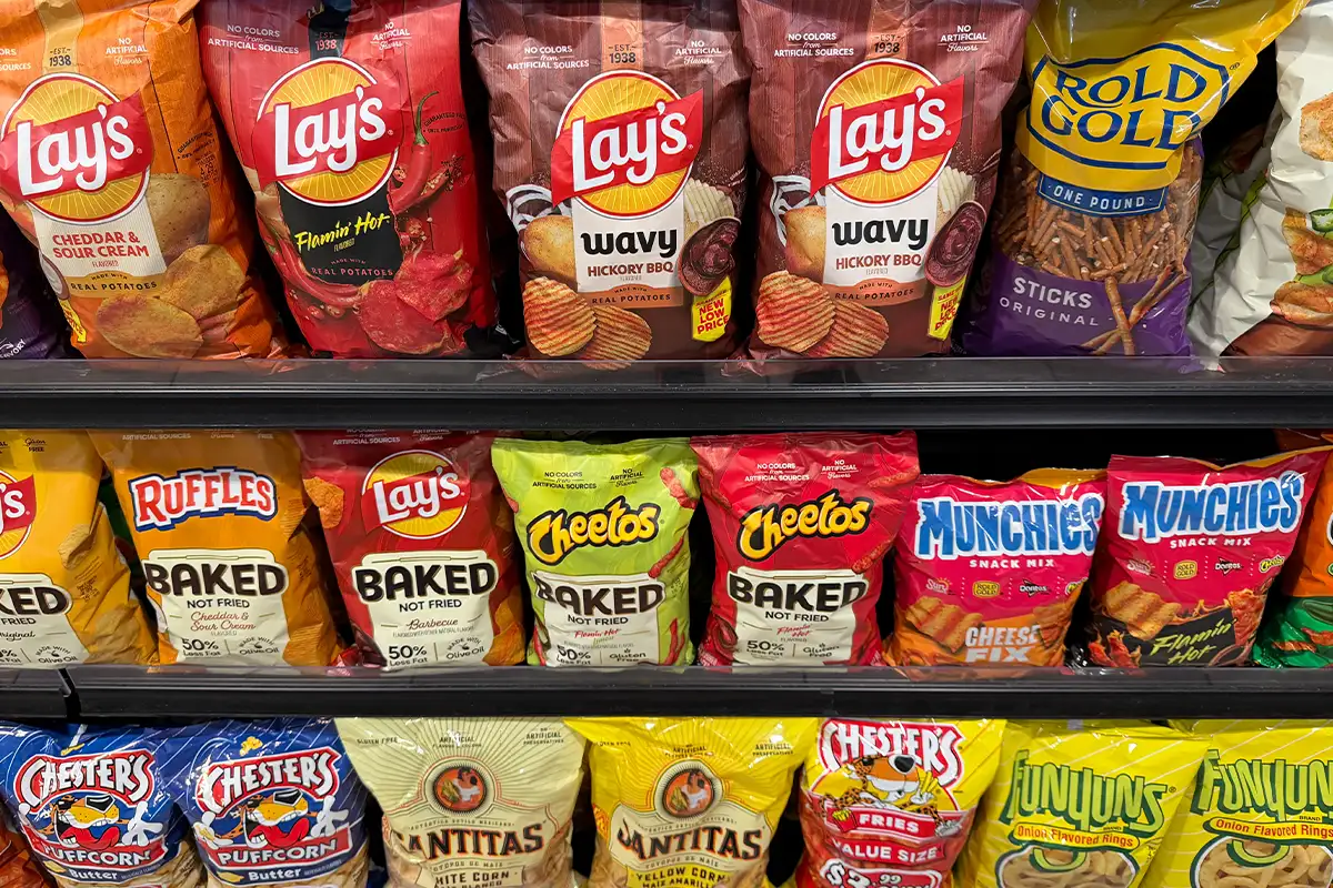 potato chips and other snacks on a store shelf