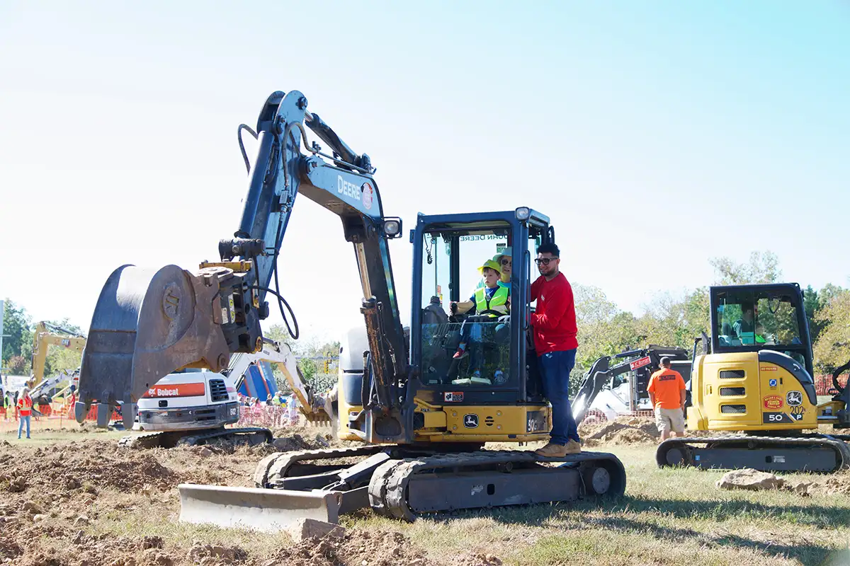 kid operating construction equipment at the Big Dig of Northern Virginia