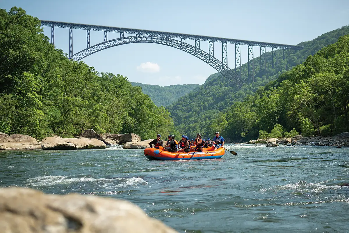 people white water rafting in new river gorge