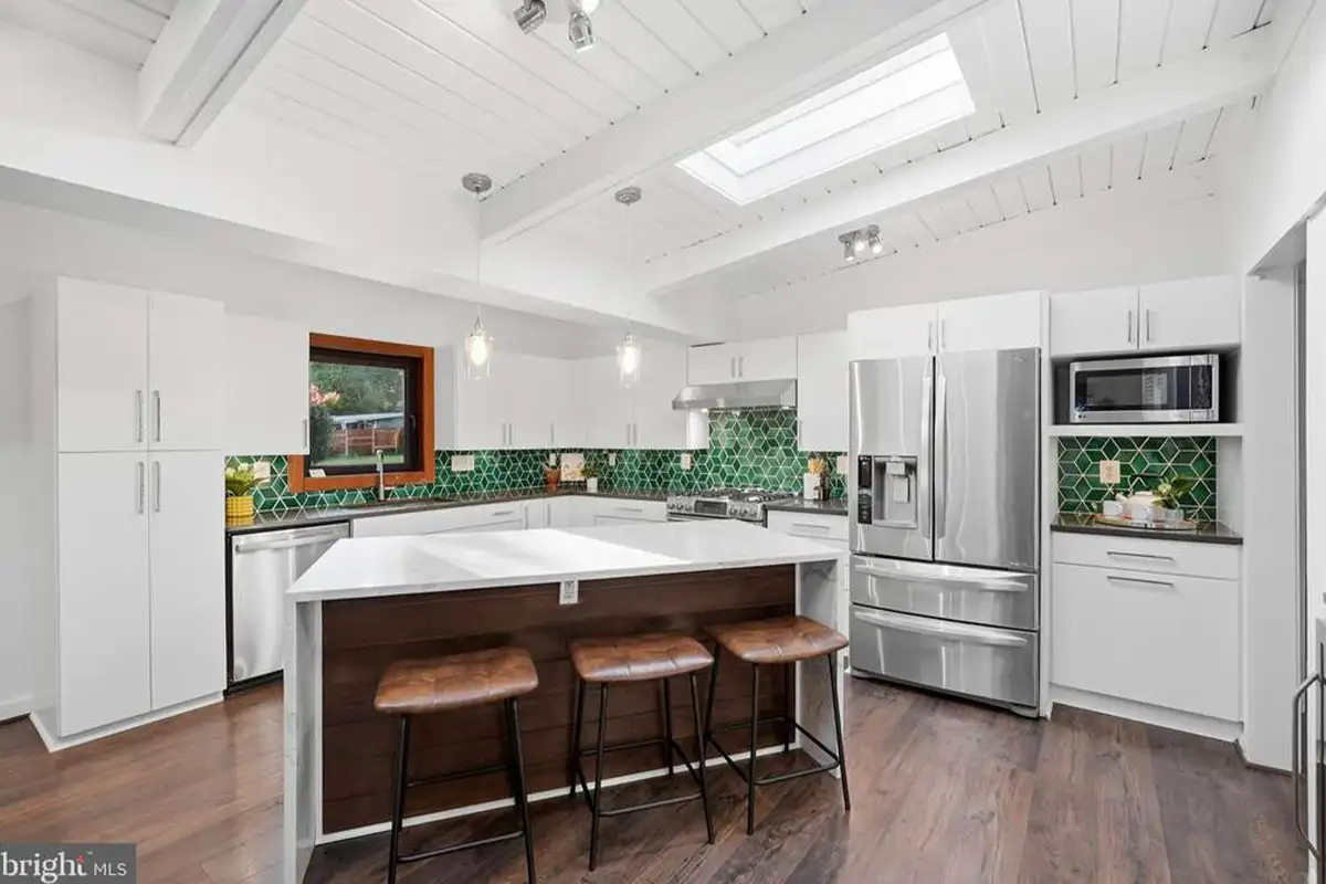 Kitchen with green tile backsplash