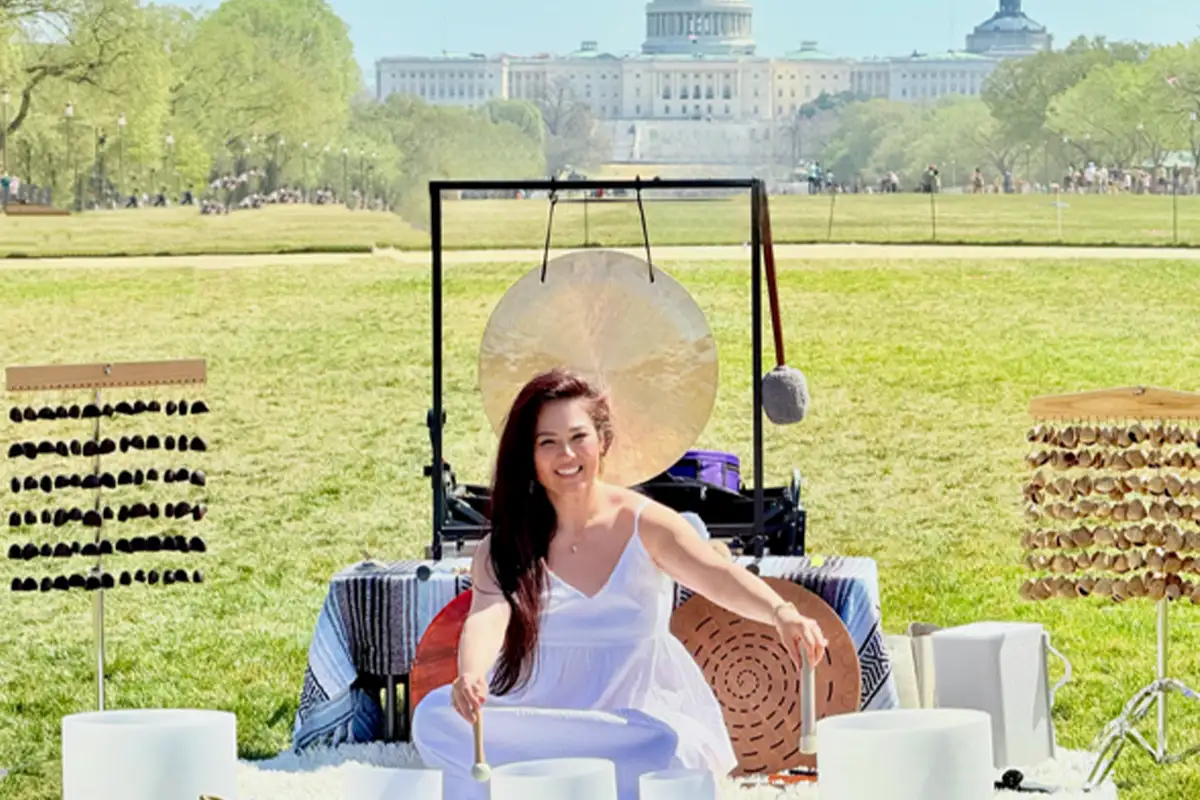 the owner of Ohm Dome in front of the U.S. Capital in DC before a sound bath session