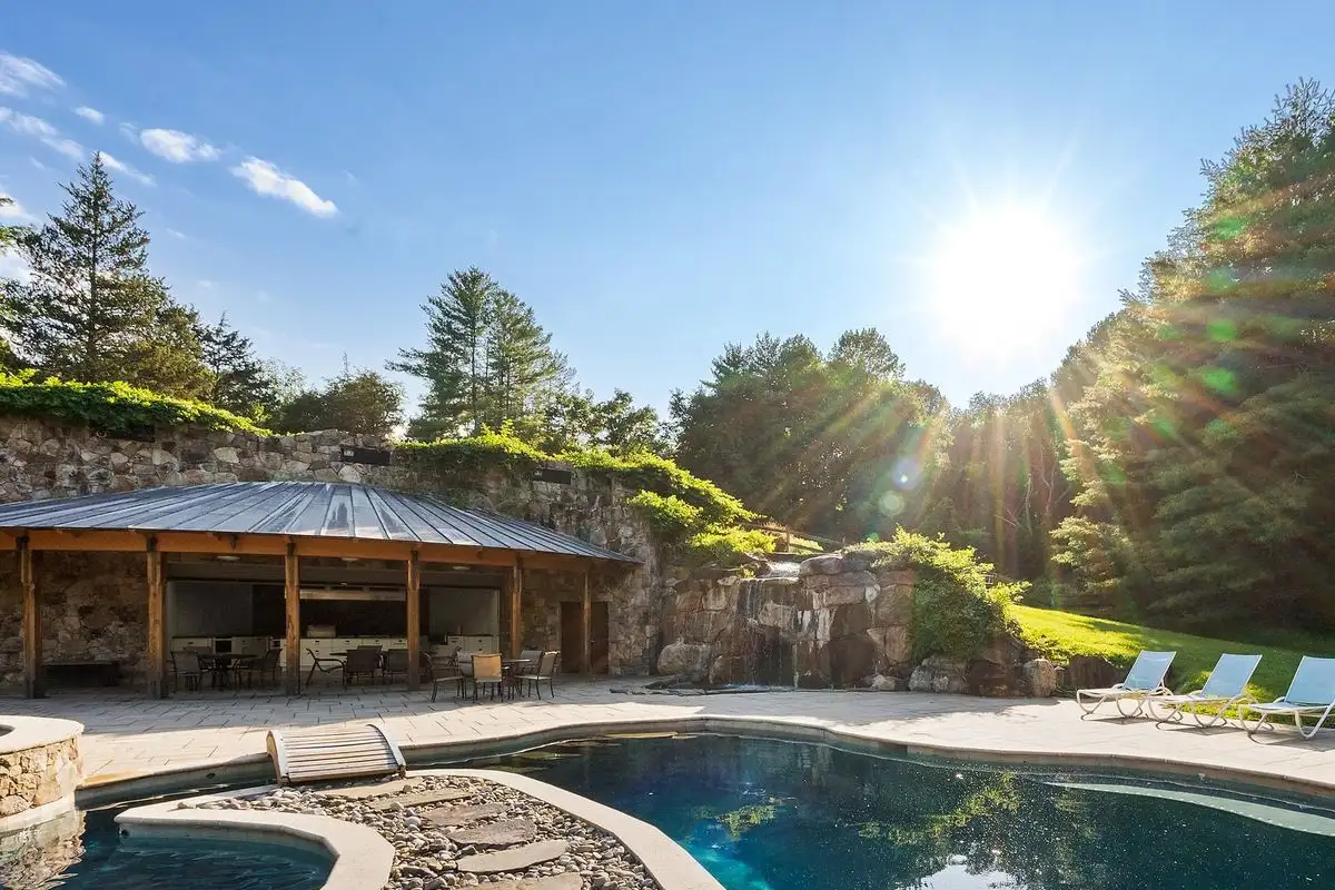 Pool with stones and hot tub