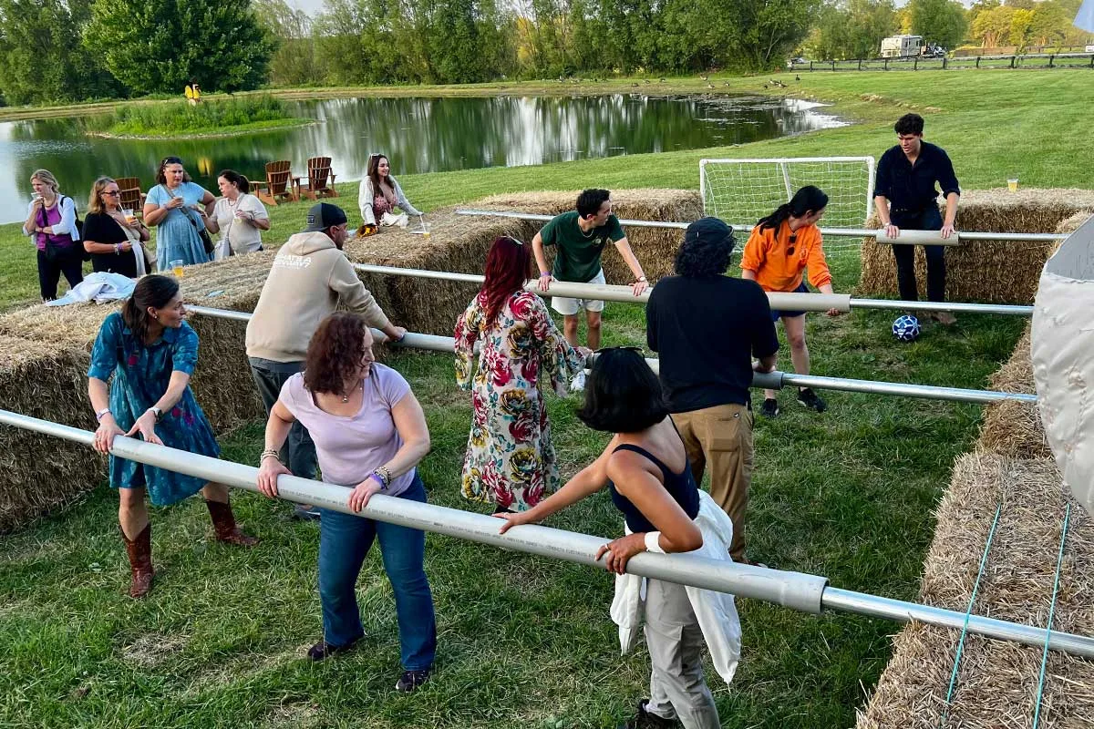 people playing life-size foosball game