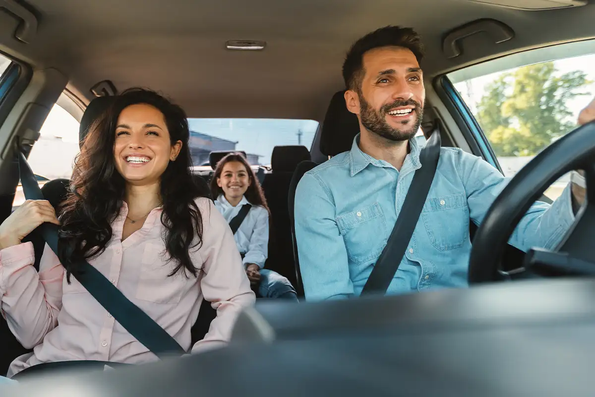 a family driving in a car