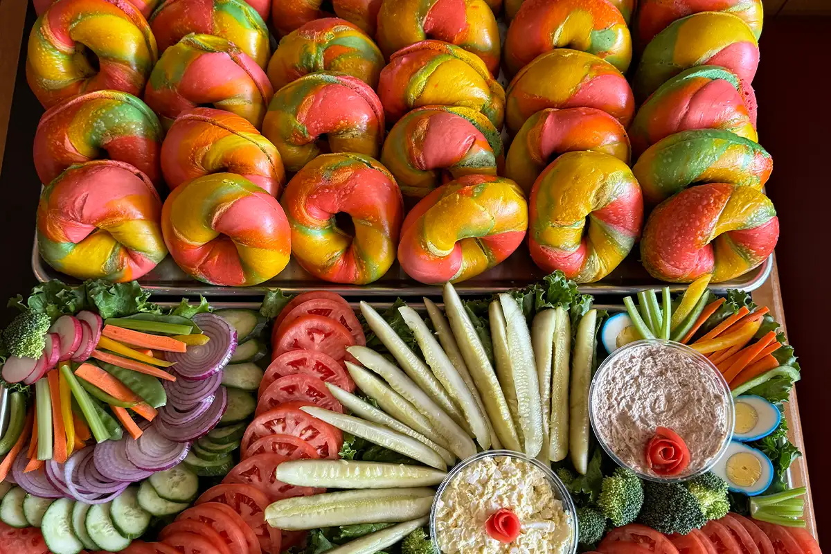 colorful bagels and vegetable spread on a platter