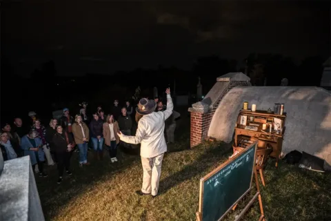 Actor performing in front of crowd Congressional Cemetery Soul Strolls