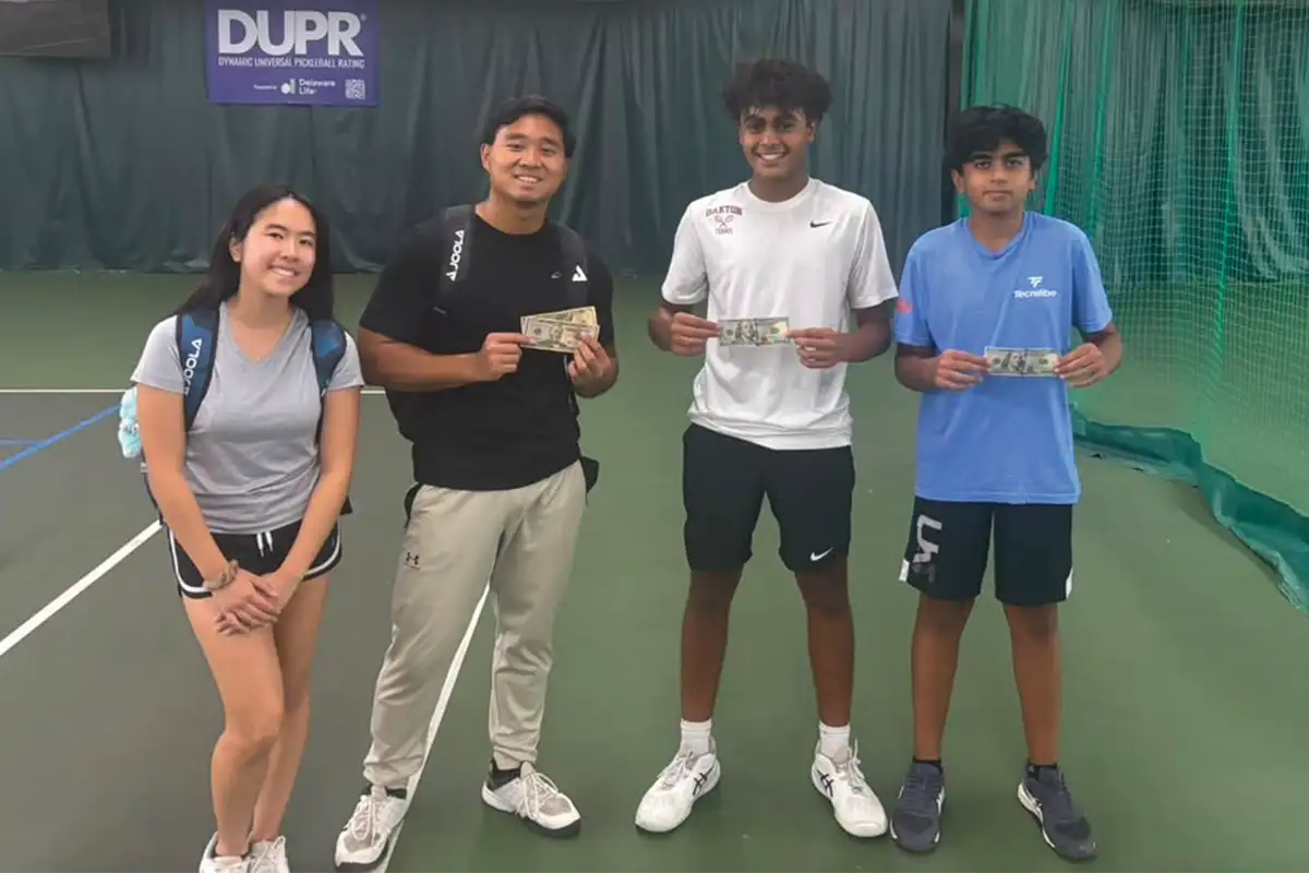 Chantilly High School students stand on a pickleball court