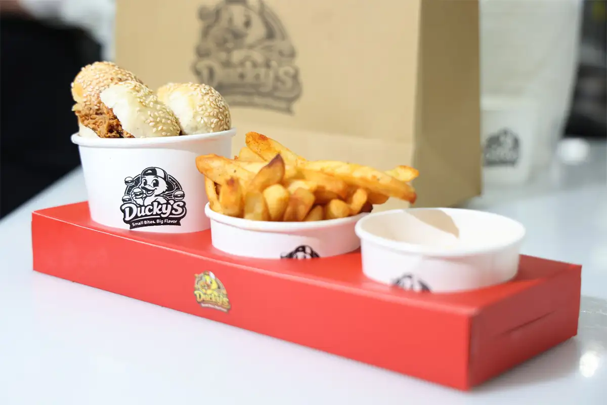 Tray of mini burgers, fries, and cheese sauce from Ducky's food truck