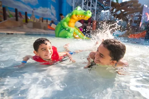 two kids swimming