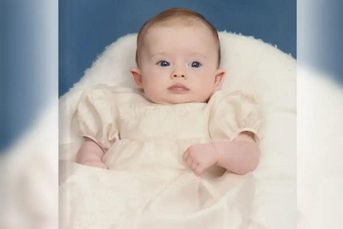 Madeleine Williams in the christening gown made from her grandmother's wedding dress