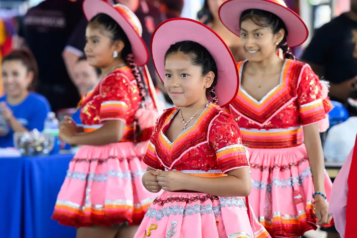 girls dressed up for dance at the Manassas Latino Festival